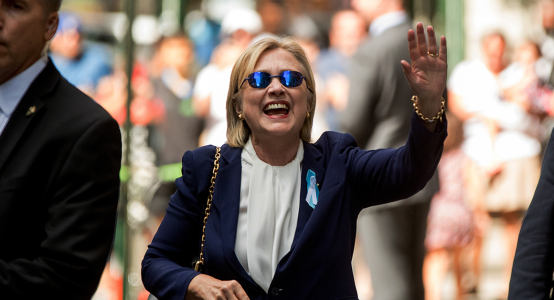 hillary-clinton-waves-after-leaving-an-apartment-building-following-her-early-departure-from-t...png