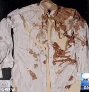 John F. Kennedy his shirt clearly indicates bleeding from throat.webp